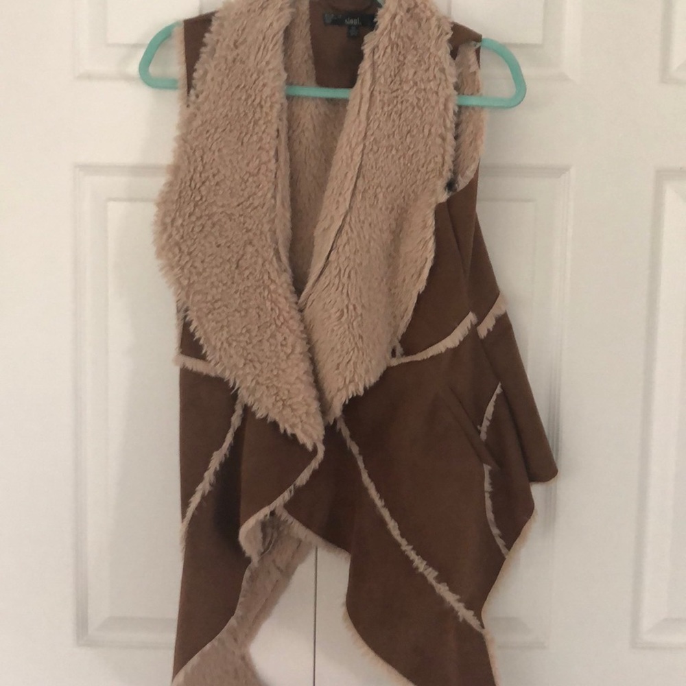 Sheepskin flyaway vest with clip to close